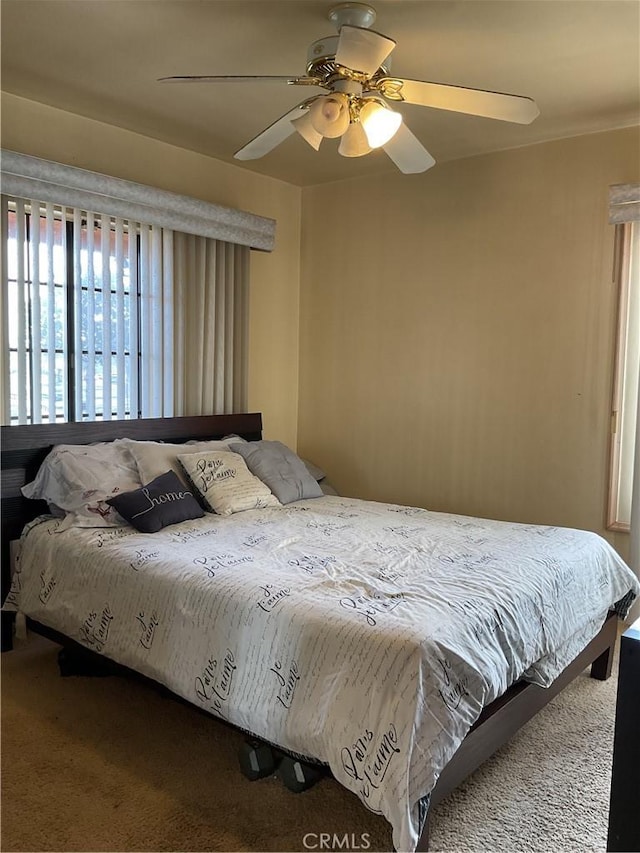 bedroom featuring ceiling fan and carpet flooring