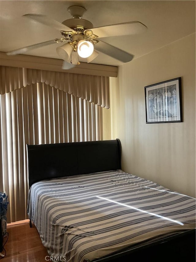 bedroom featuring ceiling fan and hardwood / wood-style flooring