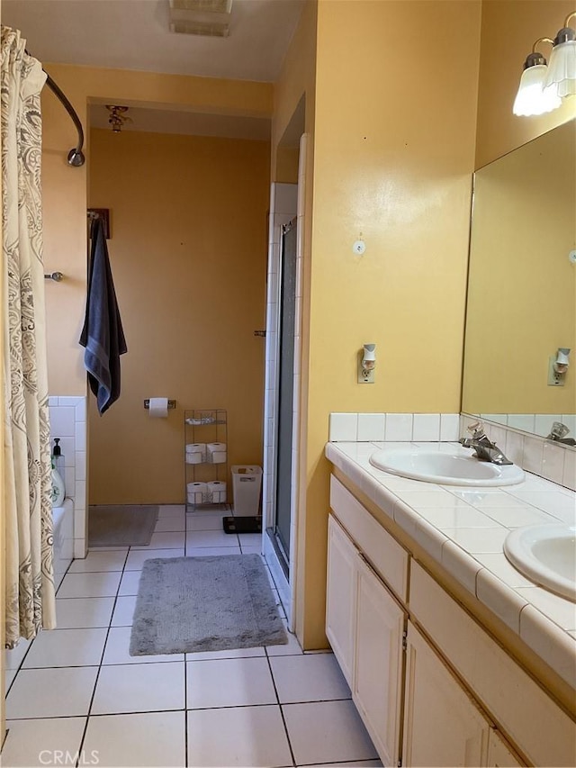 bathroom featuring tile patterned floors and vanity