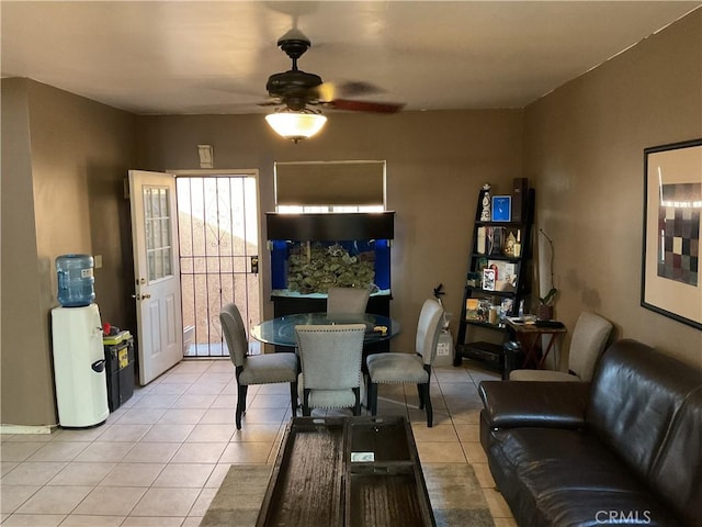 tiled dining area with ceiling fan