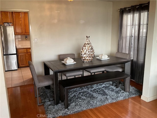 dining space featuring light hardwood / wood-style floors