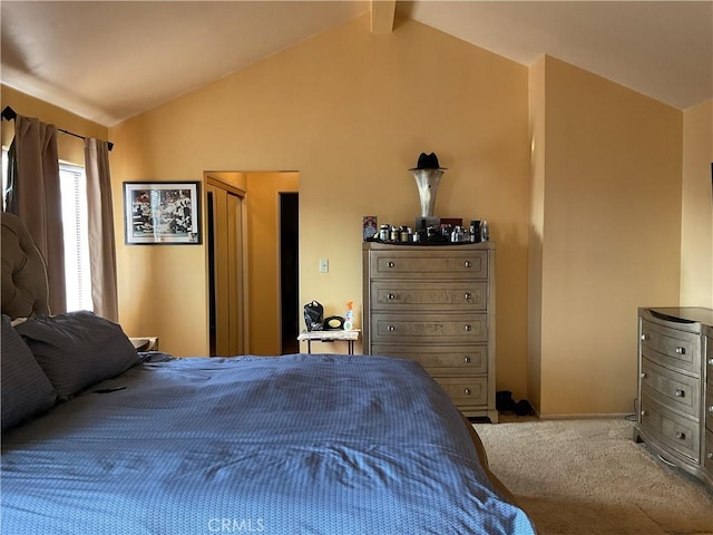 bedroom featuring carpet floors and lofted ceiling with beams