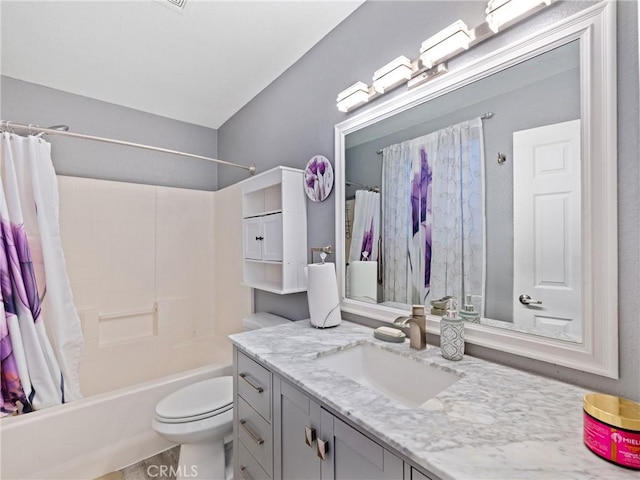 full bathroom featuring toilet, shower / bath combination with curtain, and vanity