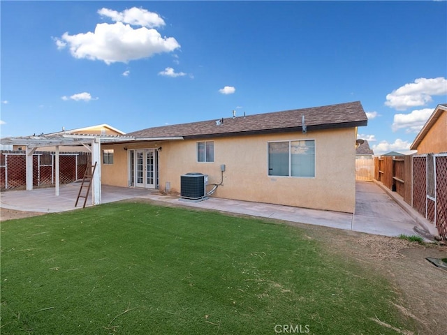 back of house featuring a patio area, a yard, central AC, french doors, and a pergola