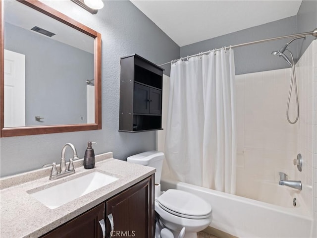 full bathroom featuring toilet, vanity, and shower / tub combo with curtain