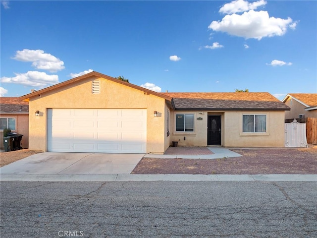 ranch-style home featuring a garage