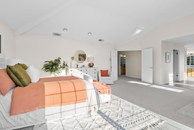 carpeted bedroom with vaulted ceiling