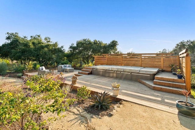 wooden deck featuring outdoor lounge area