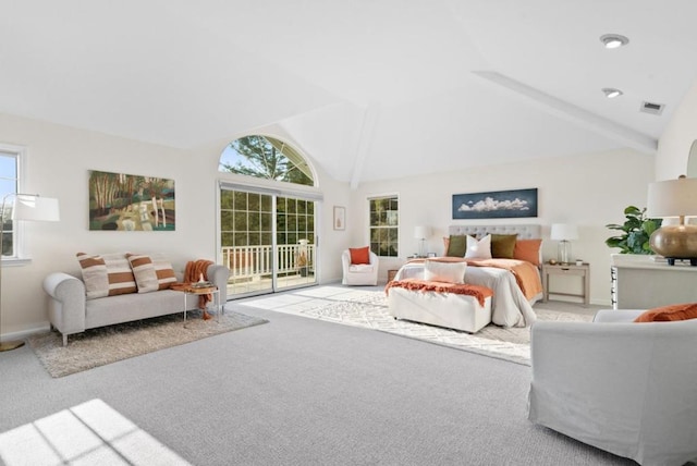 carpeted bedroom with multiple windows, access to exterior, and high vaulted ceiling