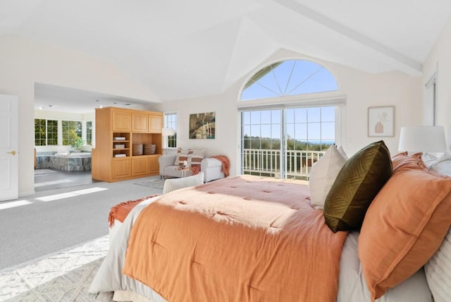 carpeted bedroom with high vaulted ceiling and access to outside