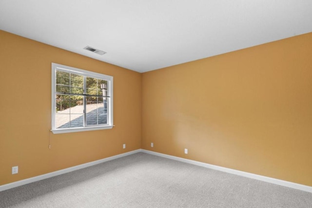 empty room featuring carpet floors