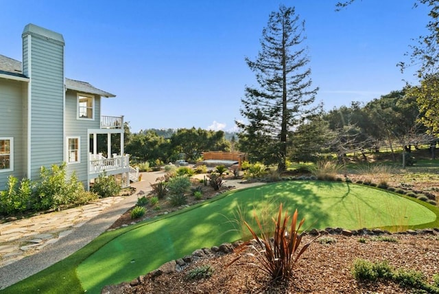 view of yard featuring a balcony