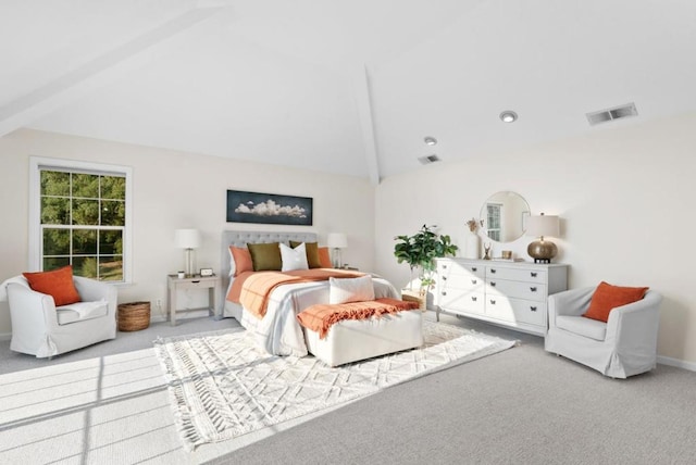 carpeted bedroom featuring vaulted ceiling