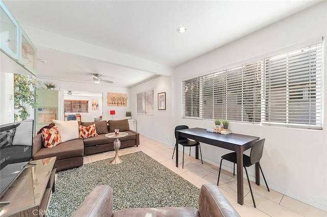 living room with ceiling fan and light tile patterned floors