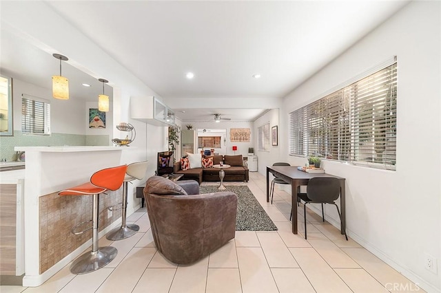 living room featuring ceiling fan, wine cooler, and light tile patterned flooring