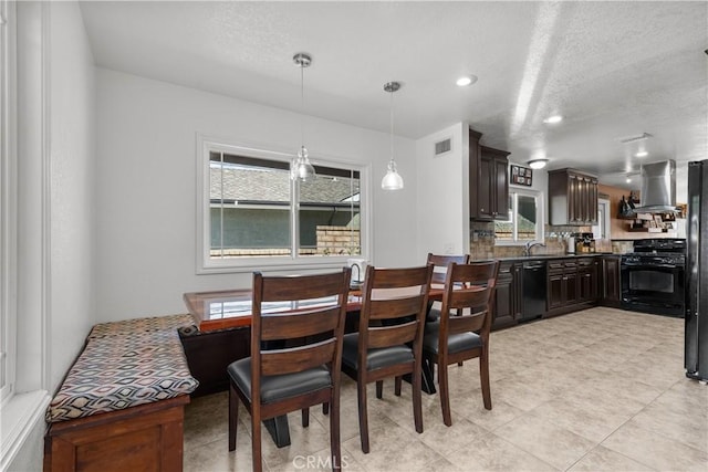 dining area with a textured ceiling