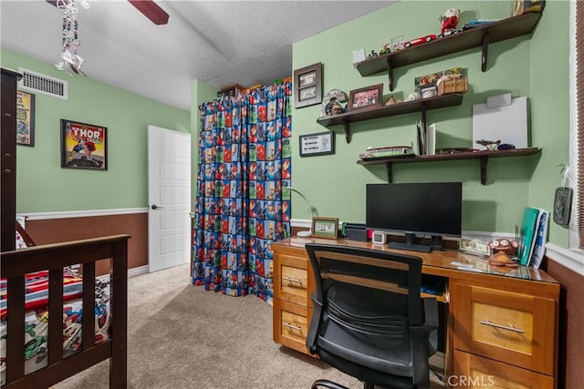 office with a textured ceiling and light carpet