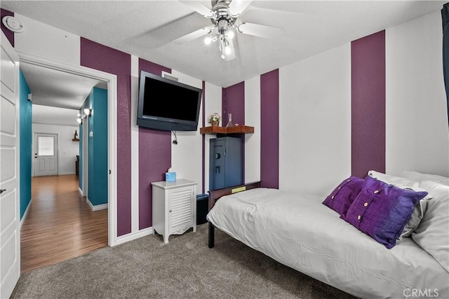 bedroom featuring ceiling fan and carpet flooring