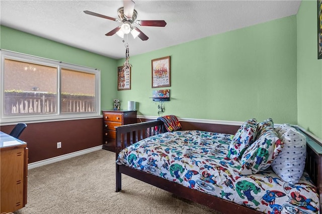 bedroom with ceiling fan and light carpet