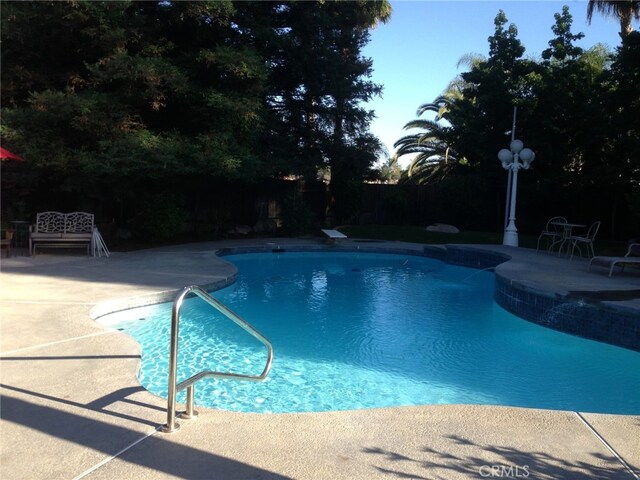 view of pool featuring a patio