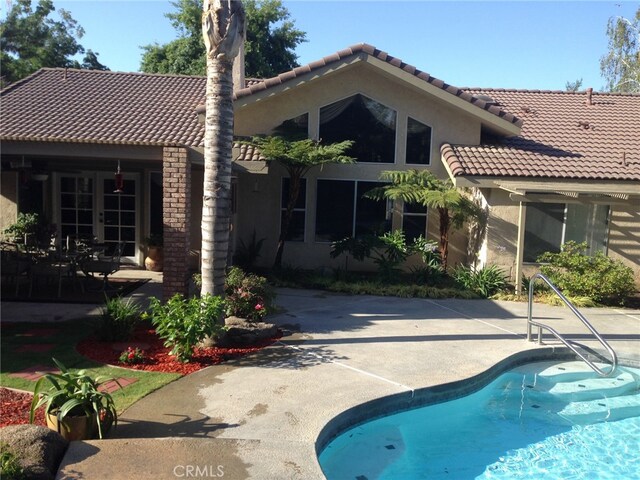 back of property featuring a patio