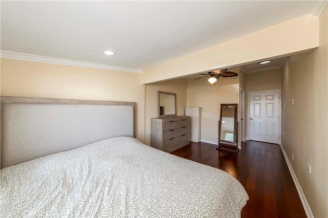 bedroom featuring ceiling fan, dark hardwood / wood-style floors, and ornamental molding