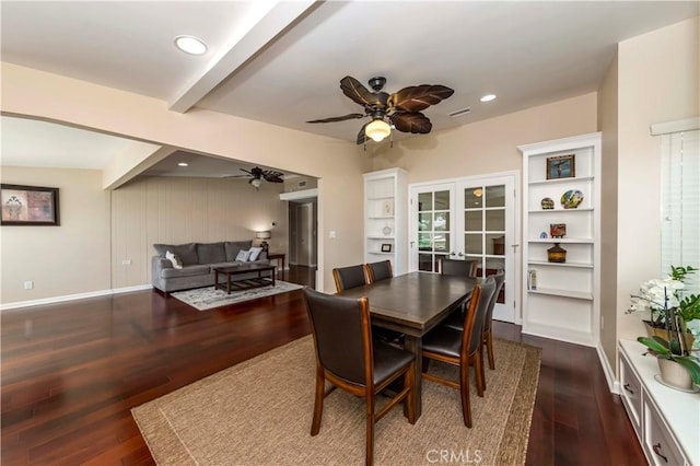 dining room with beam ceiling and dark hardwood / wood-style floors