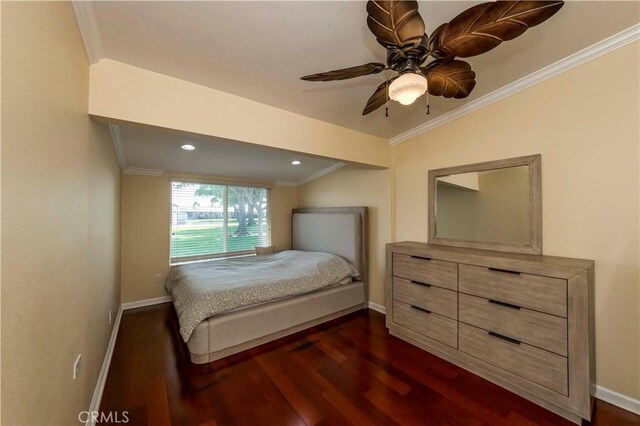 bedroom with vaulted ceiling, ceiling fan, dark hardwood / wood-style flooring, and ornamental molding