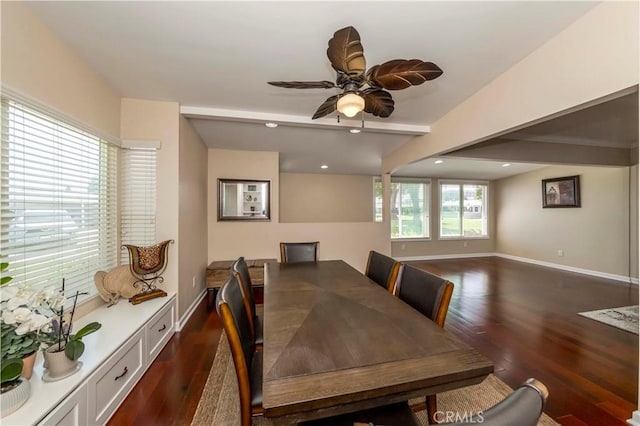 dining space with ceiling fan, dark hardwood / wood-style flooring, and beamed ceiling