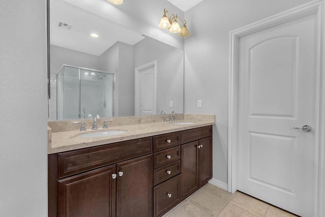 bathroom with vanity, tile patterned floors, and an enclosed shower