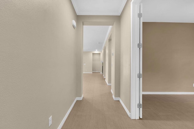 corridor featuring crown molding