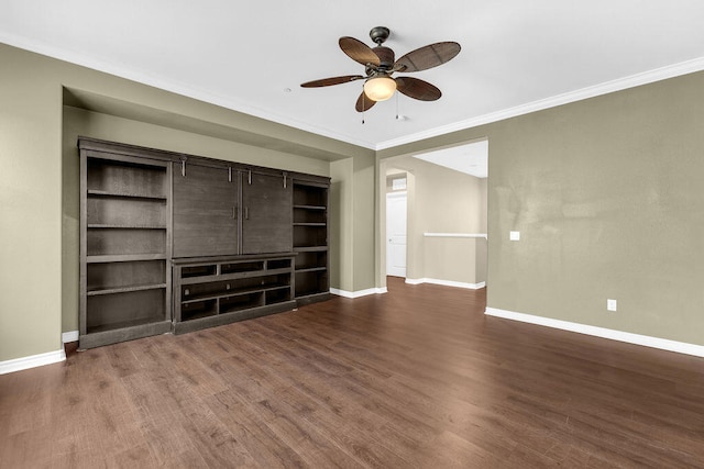 unfurnished living room with ceiling fan, dark wood-type flooring, and ornamental molding