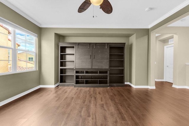 unfurnished living room featuring ceiling fan, ornamental molding, and hardwood / wood-style flooring