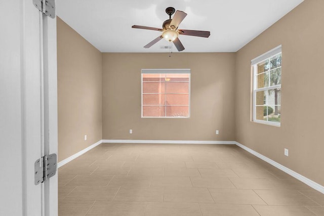 spare room with ceiling fan