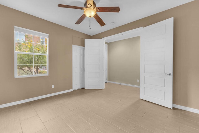 unfurnished bedroom featuring ceiling fan