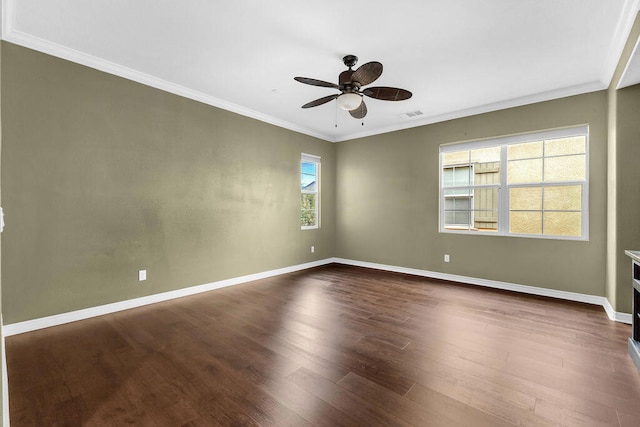 unfurnished room featuring dark wood-type flooring, crown molding, and ceiling fan