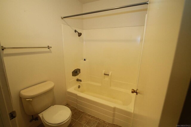 bathroom with toilet and shower / tub combination