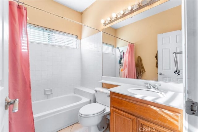 full bathroom featuring shower / tub combo, tile patterned flooring, vanity, and toilet