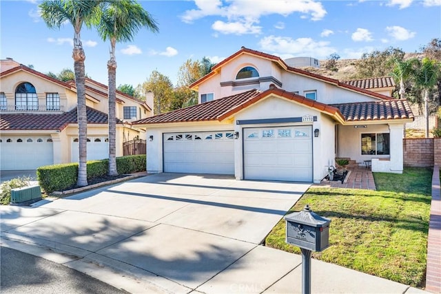 view of front of property featuring a garage and a front yard