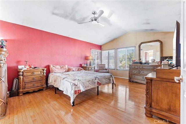 bedroom featuring vaulted ceiling, ceiling fan, and light hardwood / wood-style flooring