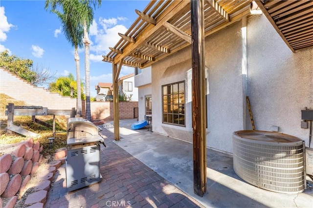 view of patio / terrace featuring central air condition unit and a pergola