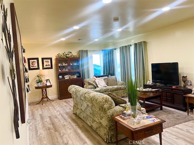 living room with light hardwood / wood-style flooring