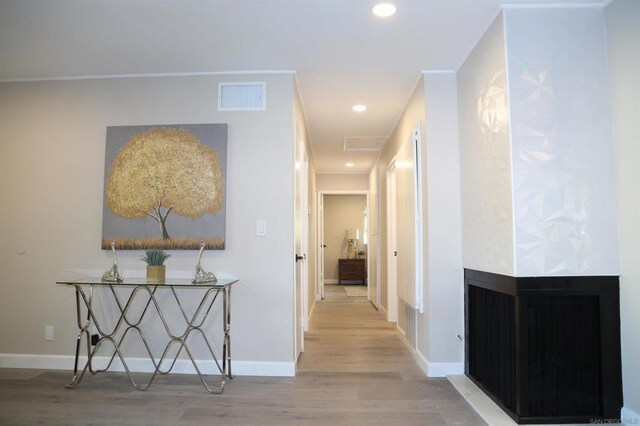 hall with light hardwood / wood-style flooring