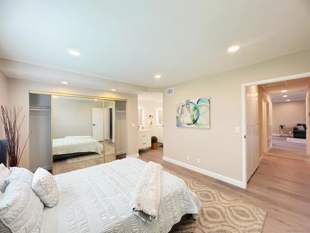 bedroom featuring light wood-type flooring