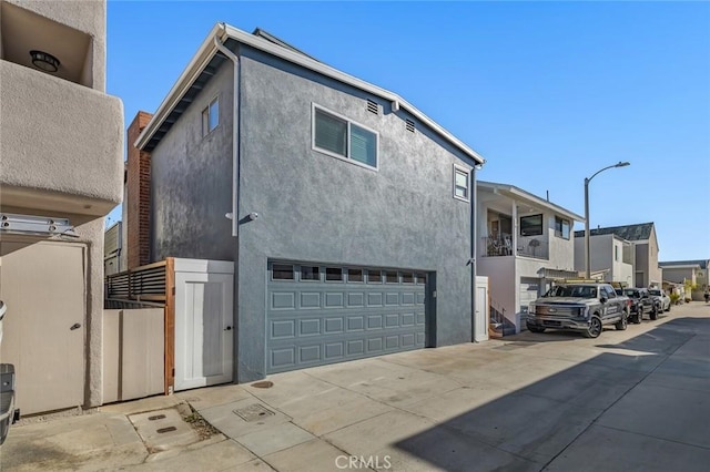 view of side of home with a garage