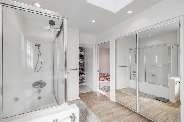 bathroom with shower / bath combination with glass door