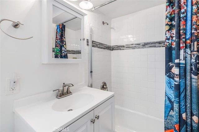 bathroom featuring vanity and shower / tub combo with curtain