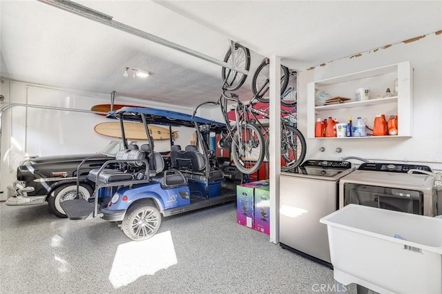 interior space with washing machine and dryer and sink