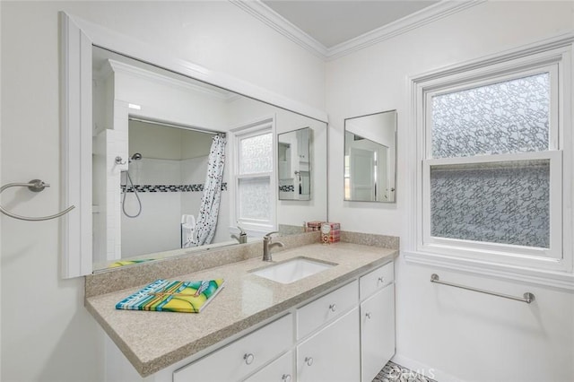 bathroom with vanity, curtained shower, and ornamental molding