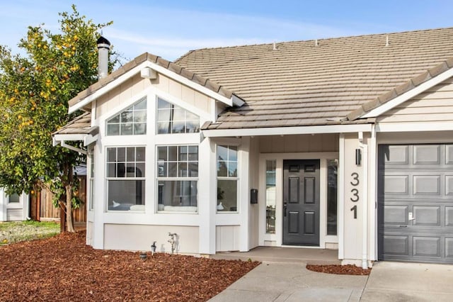 entrance to property featuring a garage